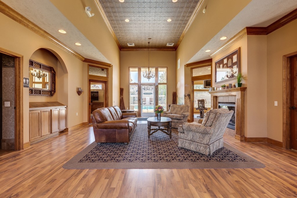 a living room filled with furniture and a fireplace