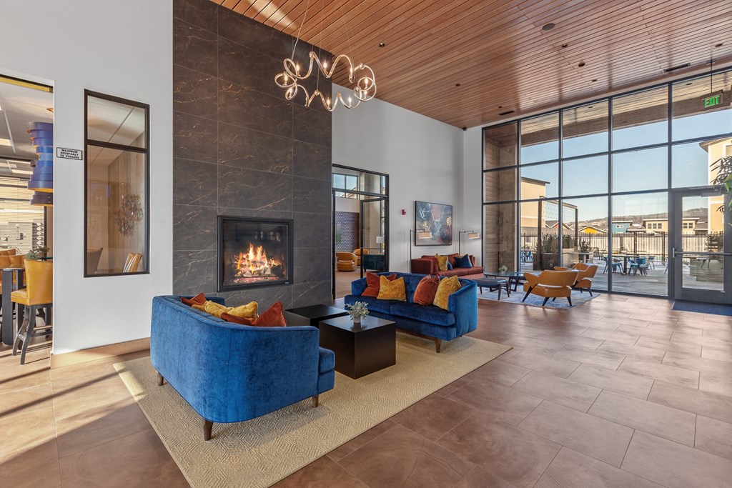 a living room filled with furniture and a fireplace