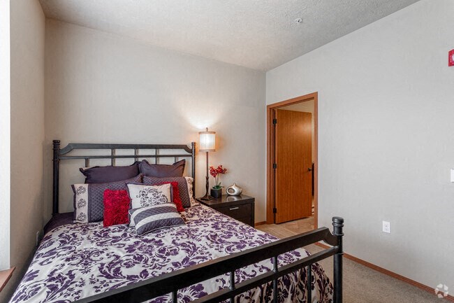 a bedroom with a bed and a nightstand