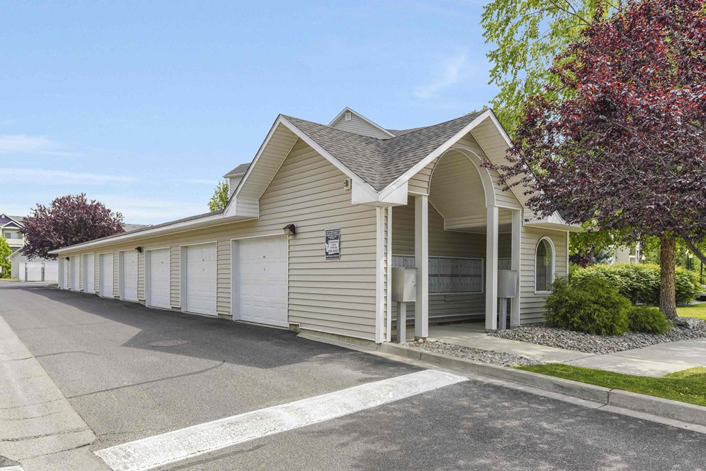 a car garage with a carport in front of a house