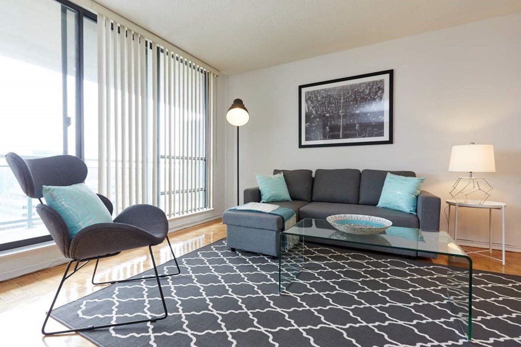 a living room with a couch and a glass table