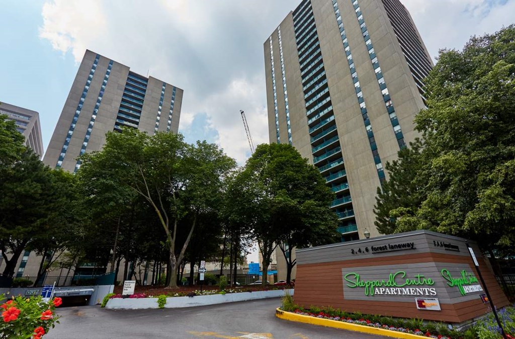 the building where the apartment is located is next to two tall buildings