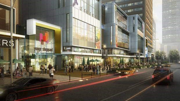 a busy city street in front of a tall building