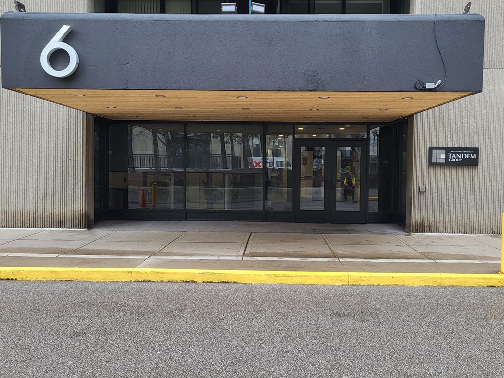 a building with a door and a sign on it