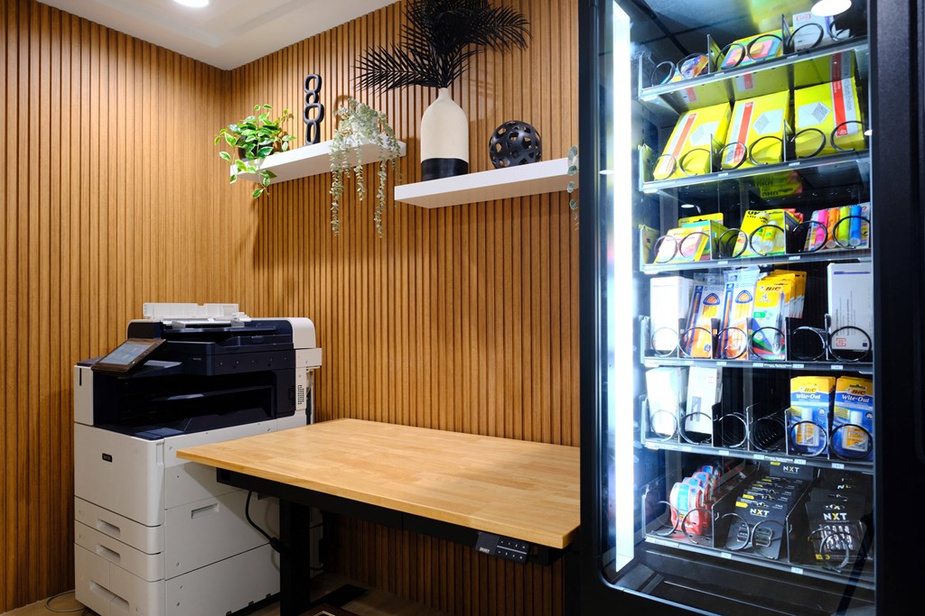 a small kitchen with a table and a refrigerator