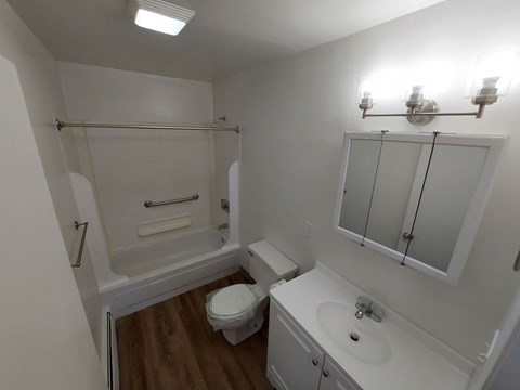 a small bathroom with a sink toilet and shower
