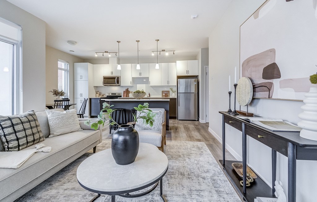 Living room with a couch and a table  at 101 Base Line Road West, Ontario