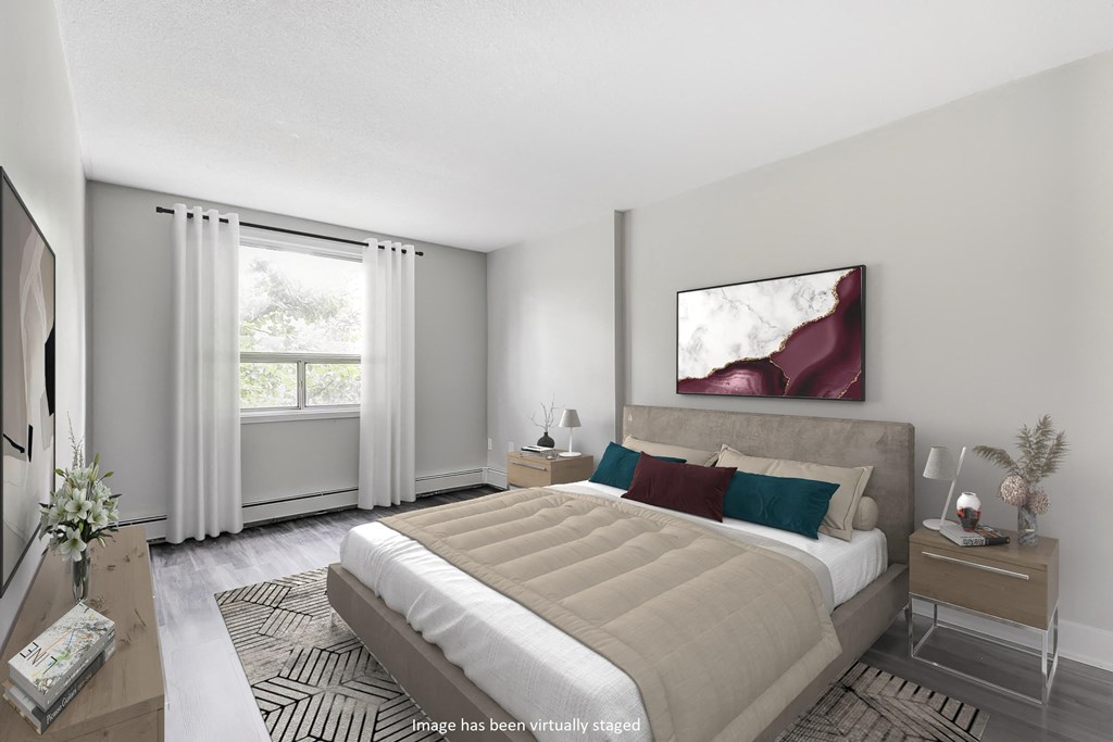 Bedroom with a large bed and a large window at Platts Crossing, London, N6H 4P4