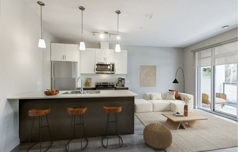 a kitchen and living room with a counter top