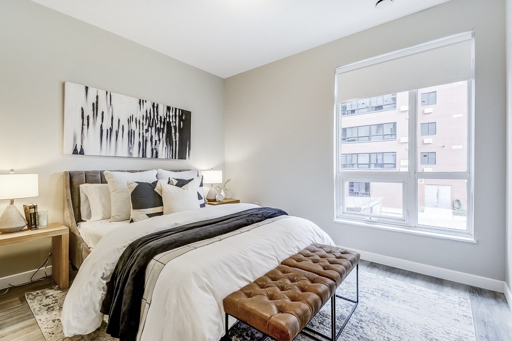 Bedroom with a large bed and a window  at 101 Base Line Road West, London, Ontario
