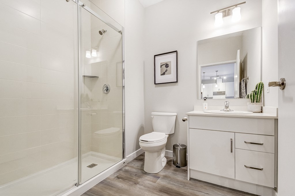 White bathroom with a shower toilet and sink  at 101 Base Line Road West, Ontario