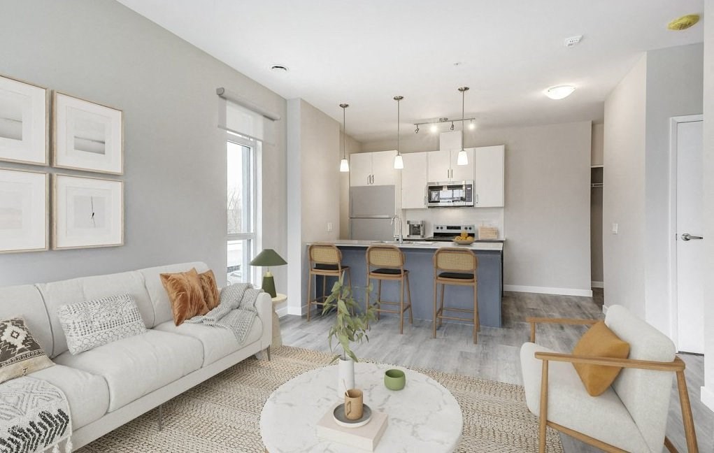 Living room and kitchen with a couch and a table  at 101 Base Line Road West, London, Ontario