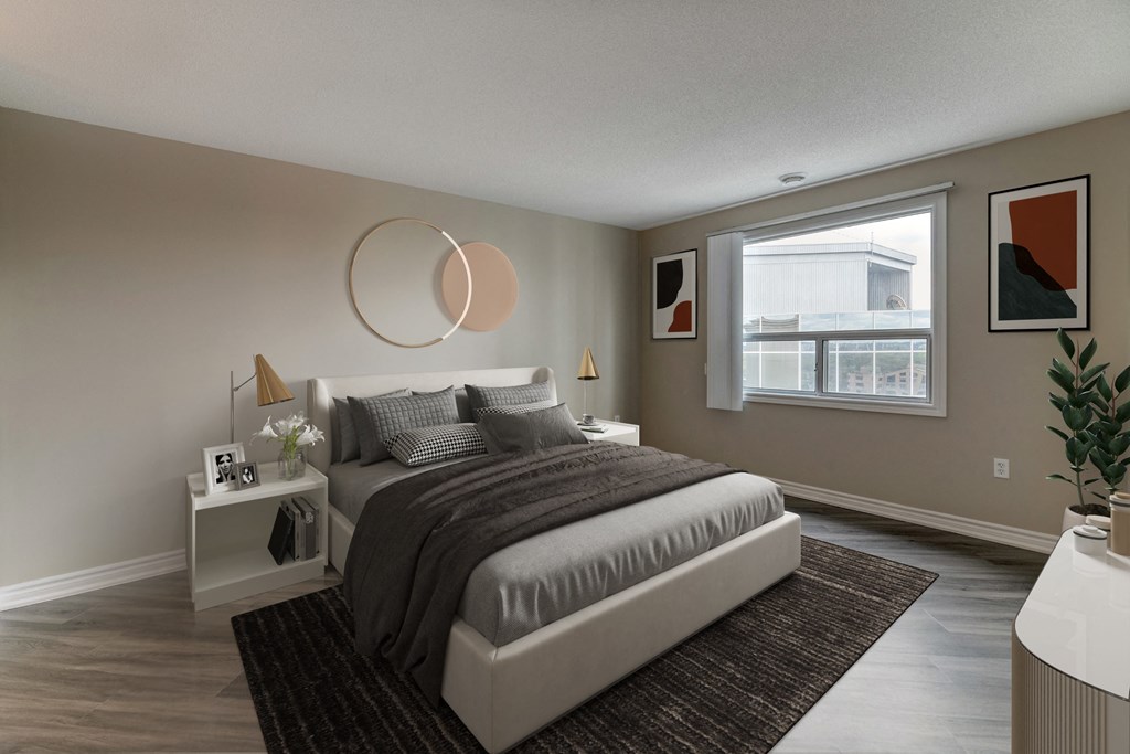 a bedroom with a bed and a window in a 555 waverly unit