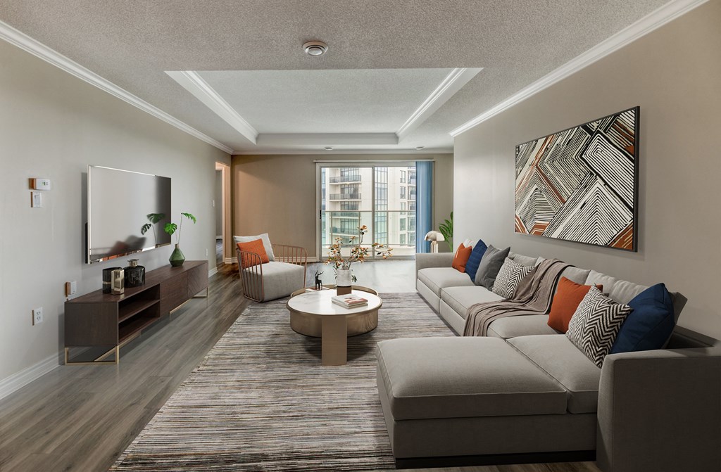 a living room with a couch coffee table and two chairs