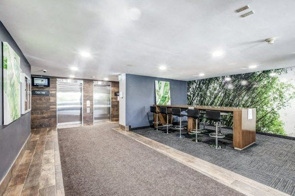a room with a table and chairs and a wall with a mural