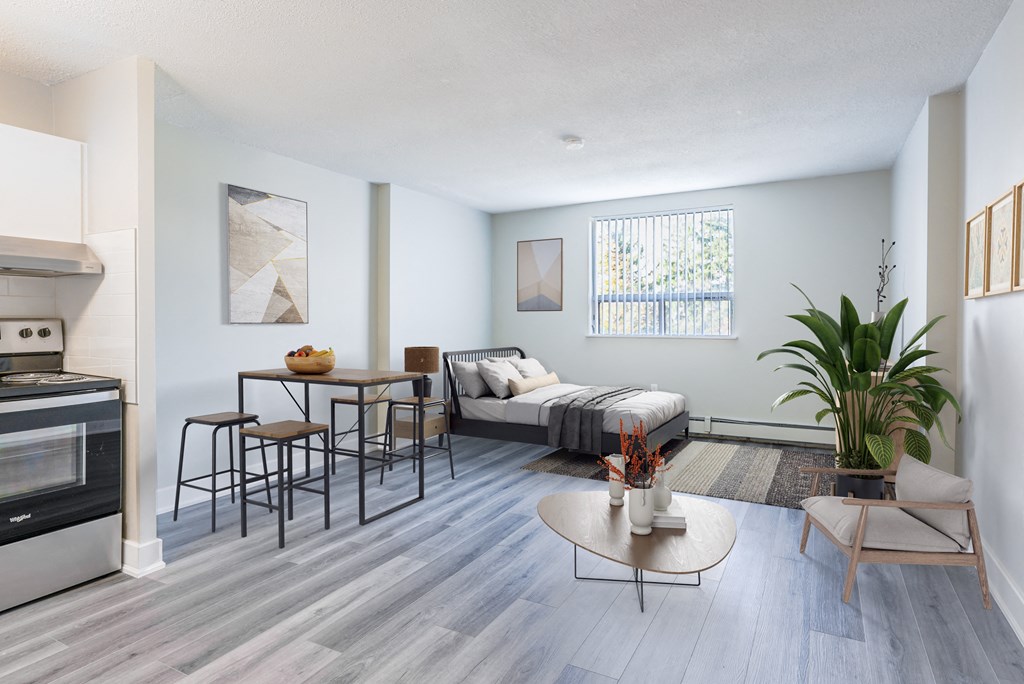 A modern kitchen with a dining table and chairs.