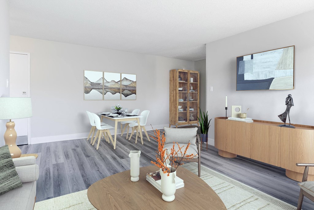 A modern living room with a wooden coffee table and a grey sofa.