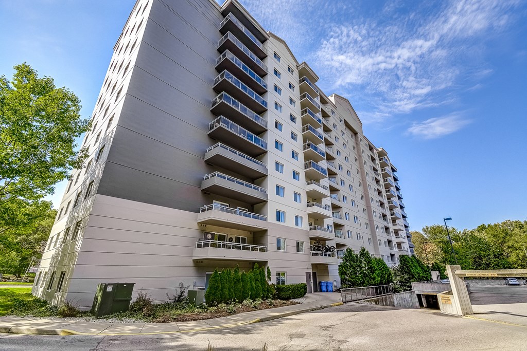 a large apartment building with many balconies on the side of it