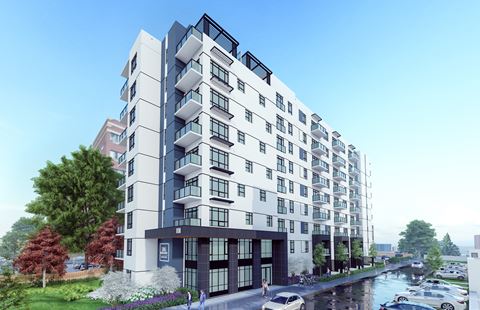 a rendering of a white and black apartment building