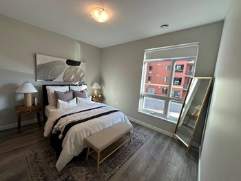 Bedroom with a bed and a large window  at 101 Base Line Road West, London