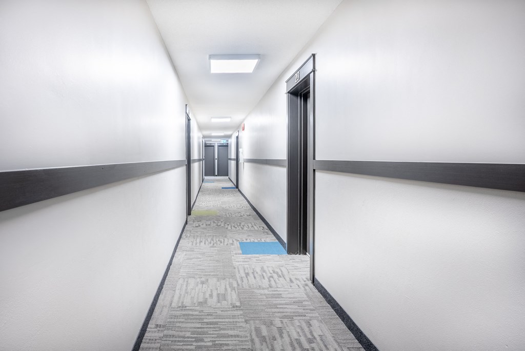 Common Area hallway at Oakland with a blue square on the floor.