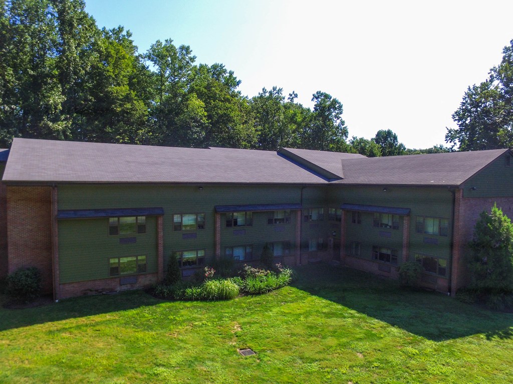 a large building with a grassy area in front of it