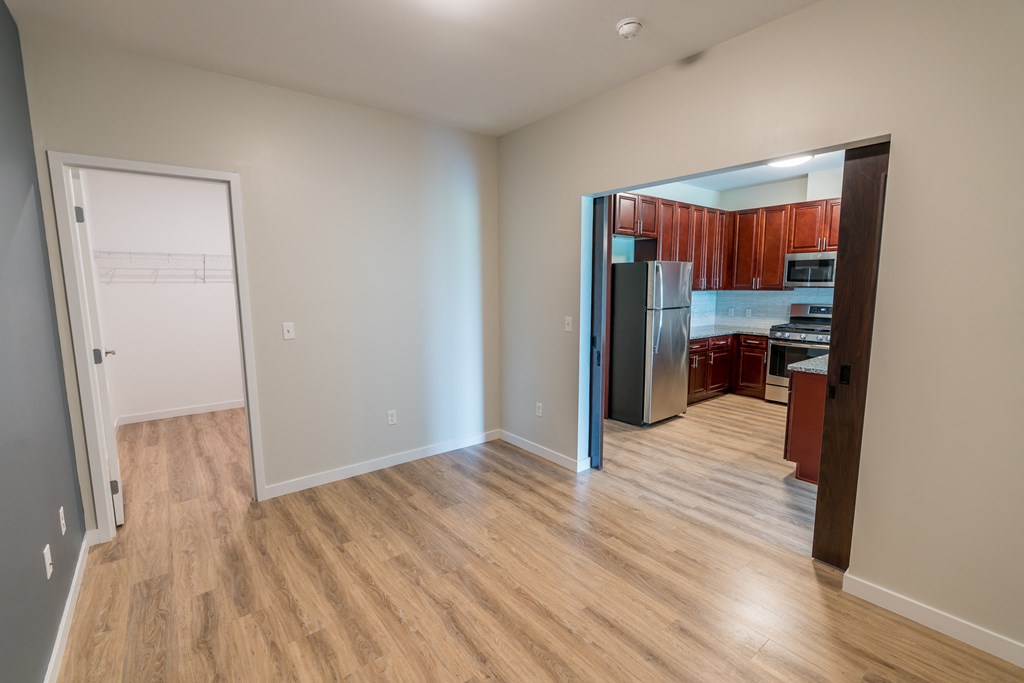 a bedroom and a kitchen in a 555 waverly unit