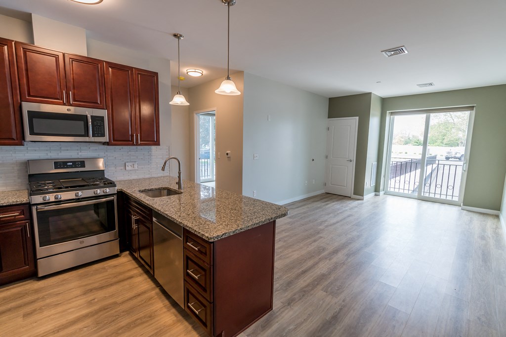 a kitchen and living room in an apartment