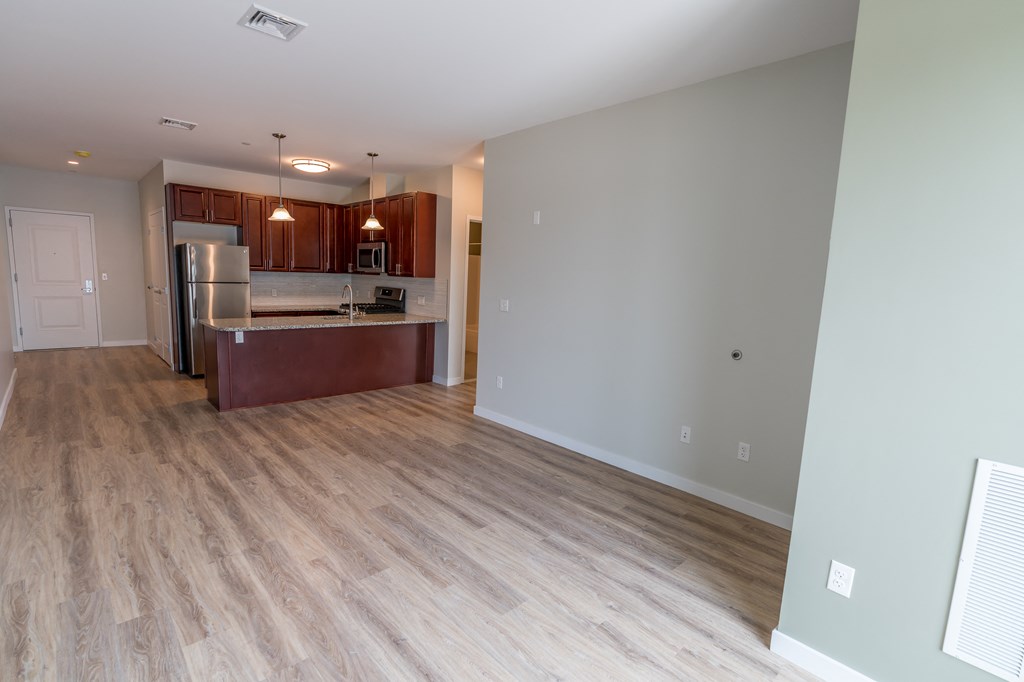 a kitchen and living room in an apartment