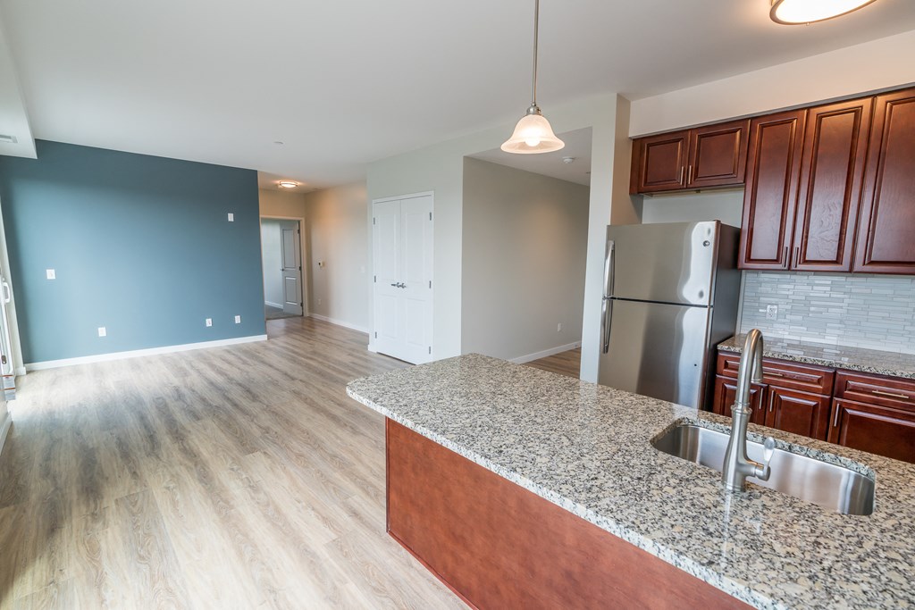 a kitchen and living room in a new home