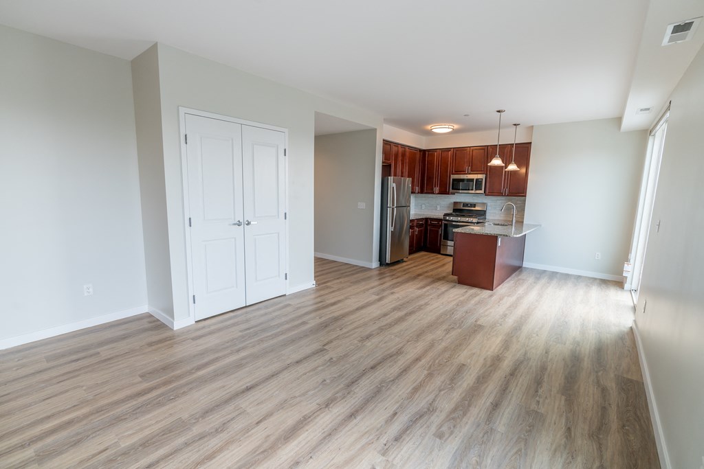 a kitchen and living room in a 555 waverly unit