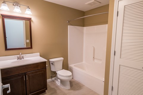 a bathroom with a toilet sink and bathtub