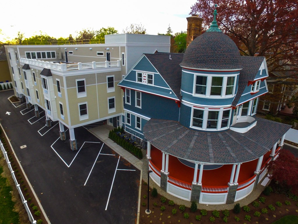 a house with a red bottom and a blue top