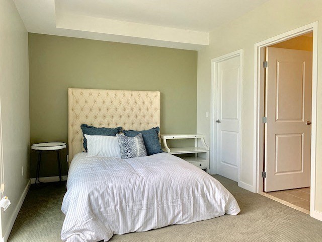 a bedroom with a bed and a nightstand