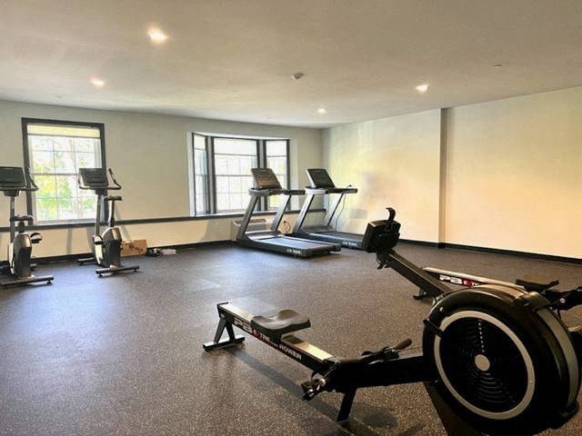 a room with a lot of exercise equipment in it
