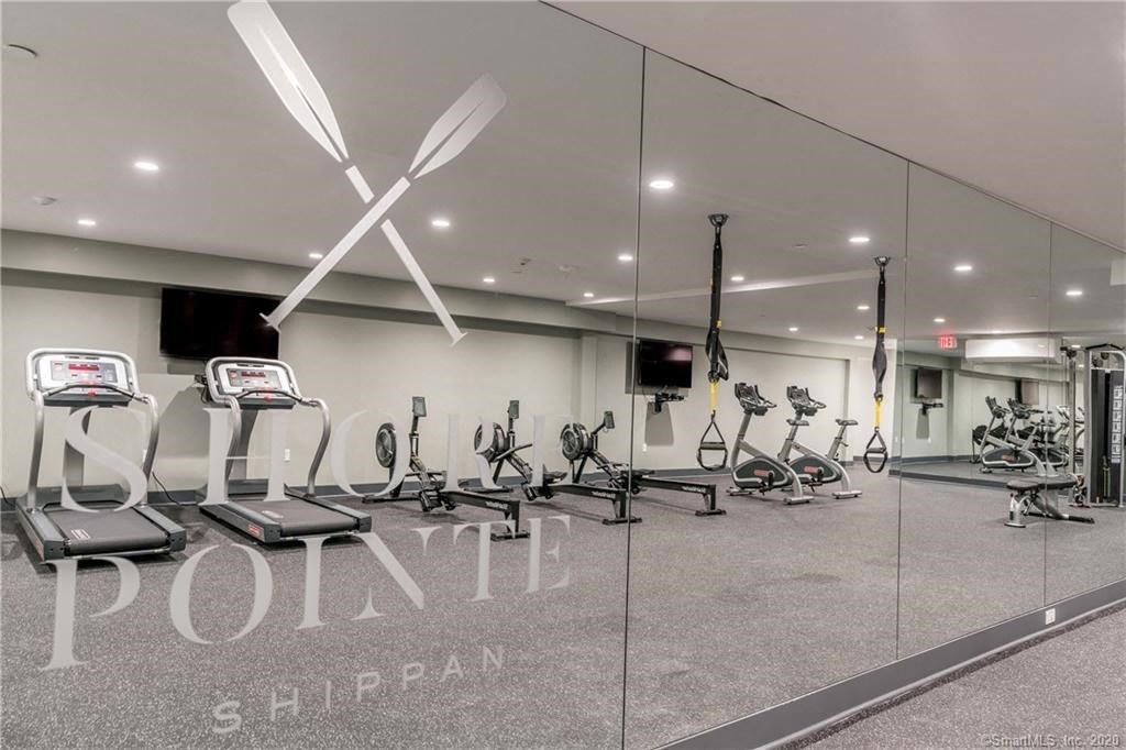 a gym with treadmills and other exercise equipment