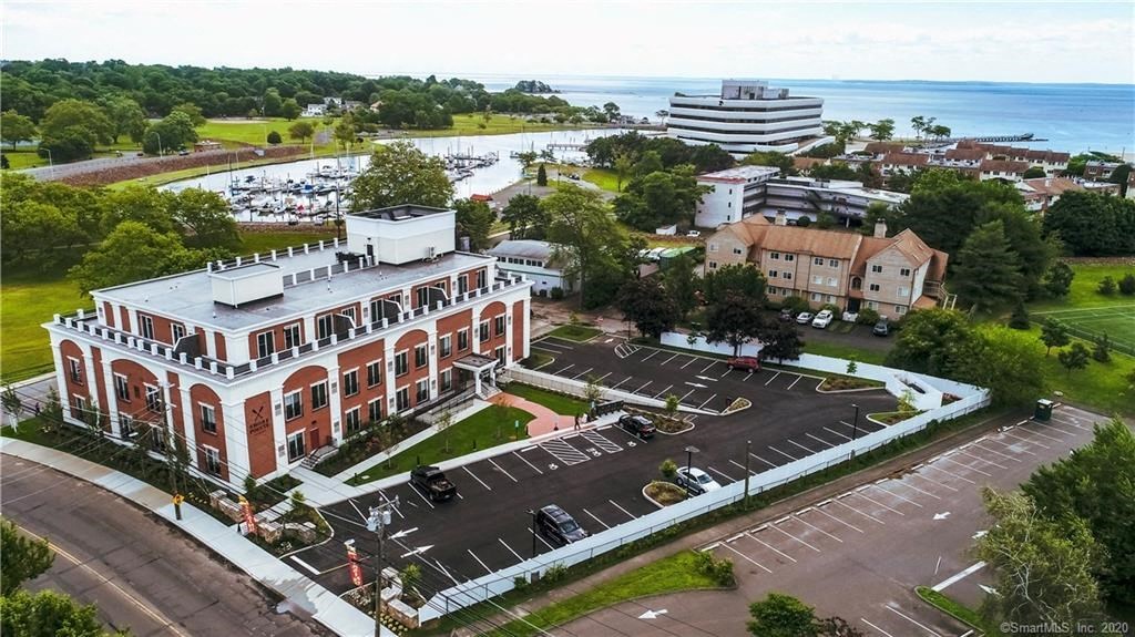 a large building with a parking lot in front of it