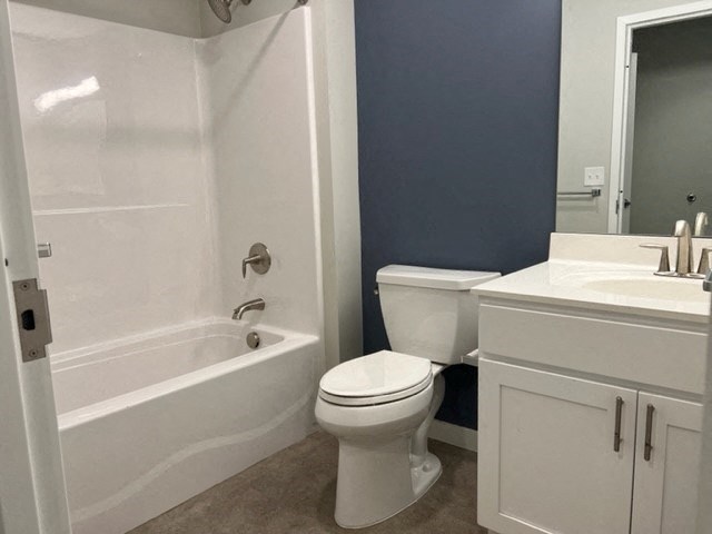 a bathroom with a toilet sink and bathtub