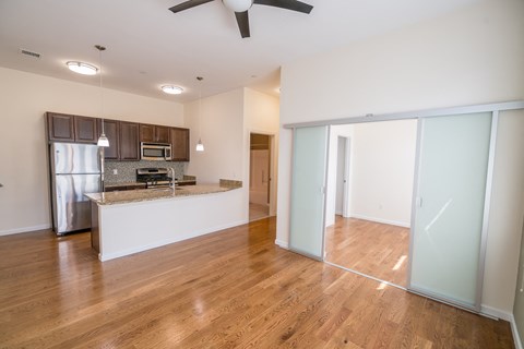 a kitchen and living room in a 555 waverly unit