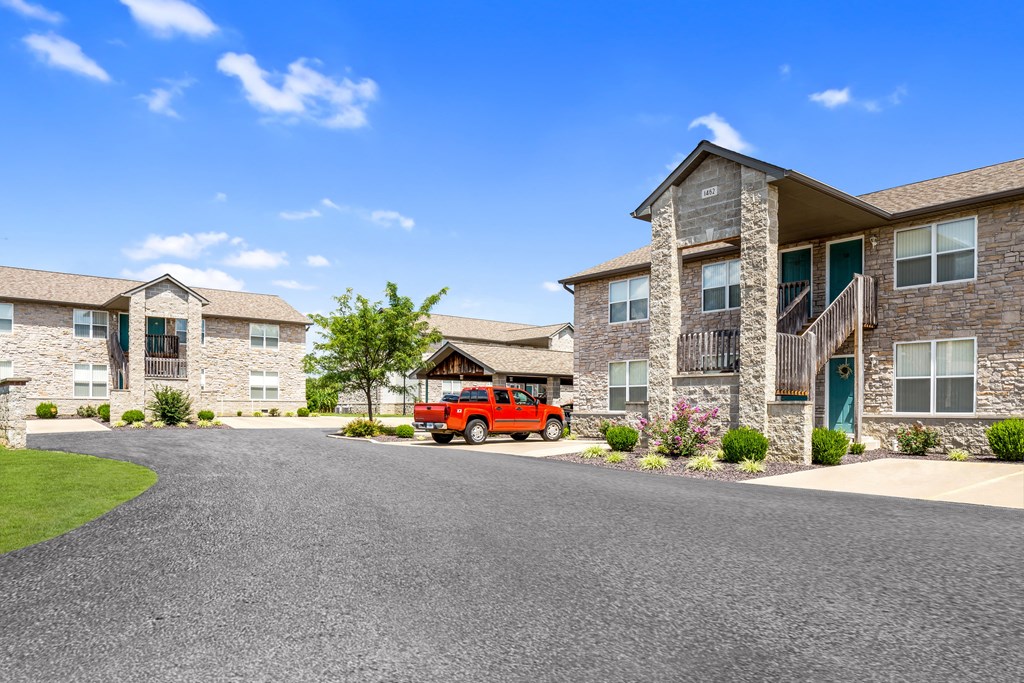 a red truck parked in front of a building
