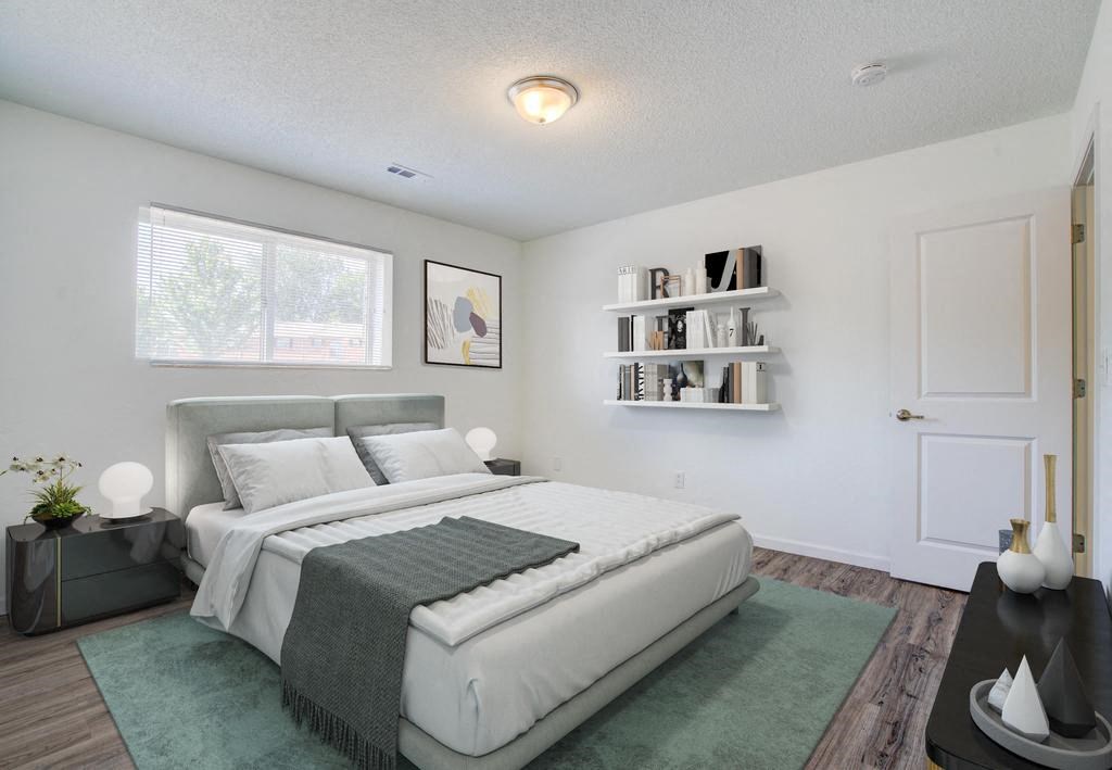 a bedroom with a bed and a bookshelf