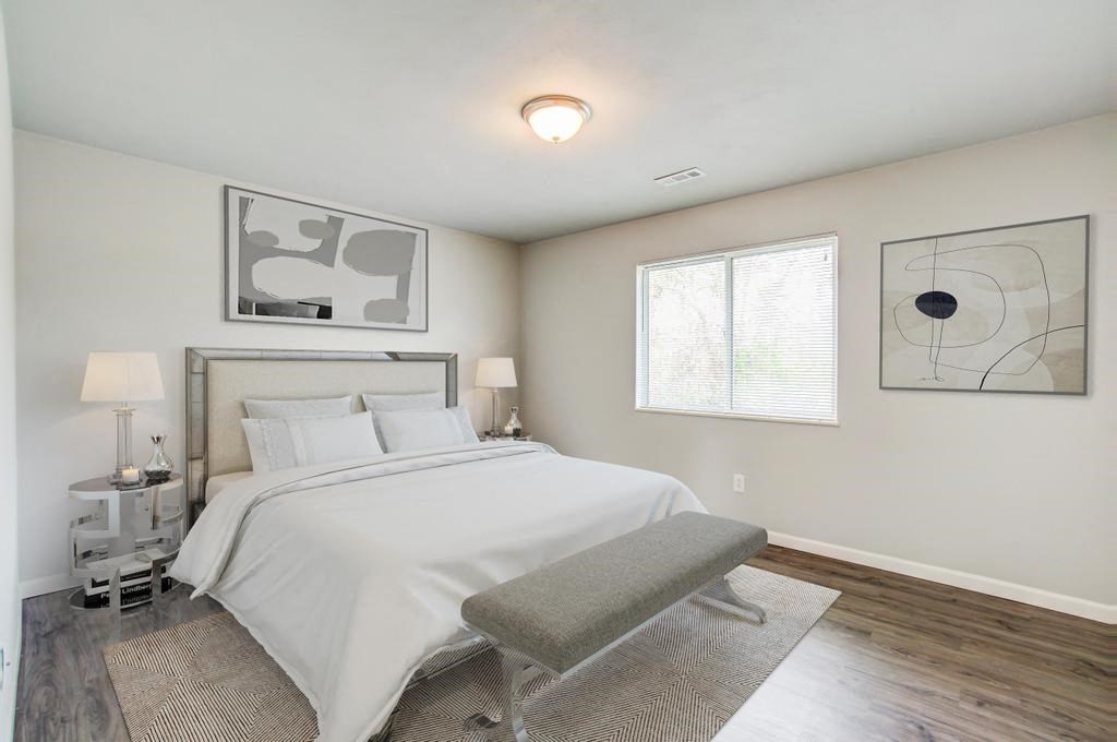 a bedroom with a bed and a window