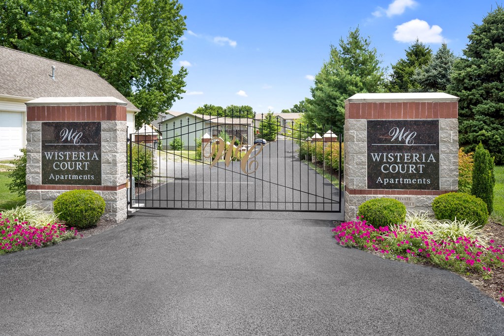 the gate to the entrance of a driveway with a gate