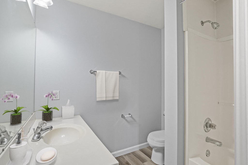 a bathroom with a sink and a toilet in a 555 waverly unit