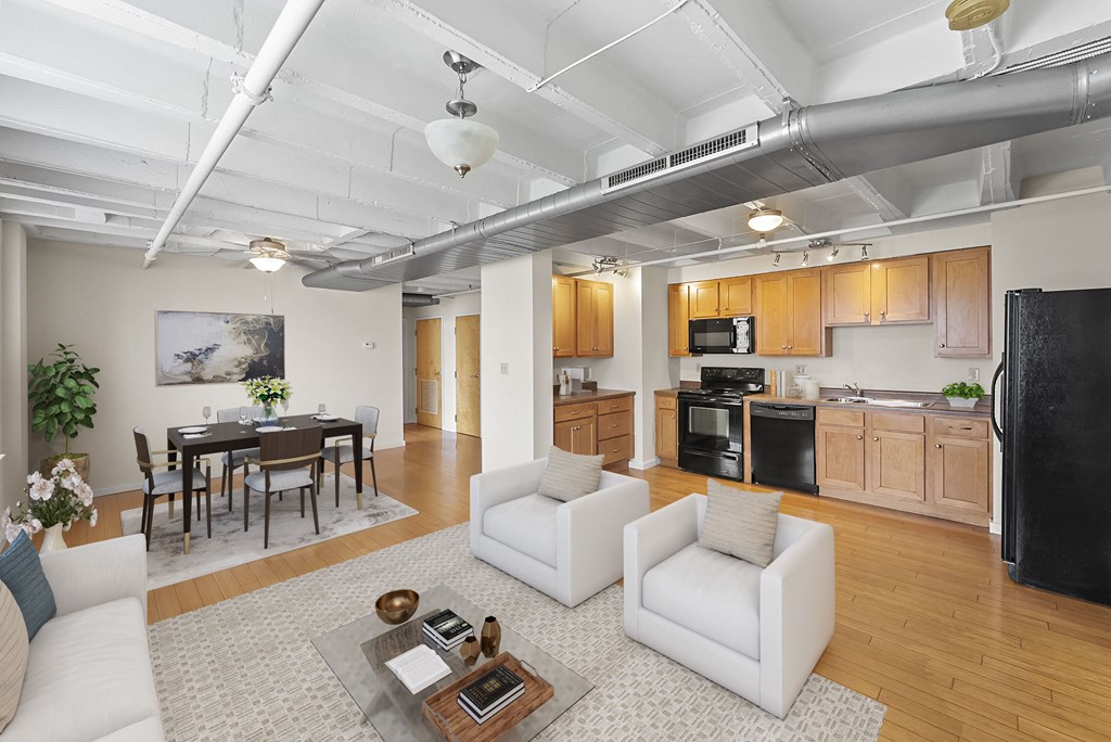 a living room with a couch and a table and a kitchen