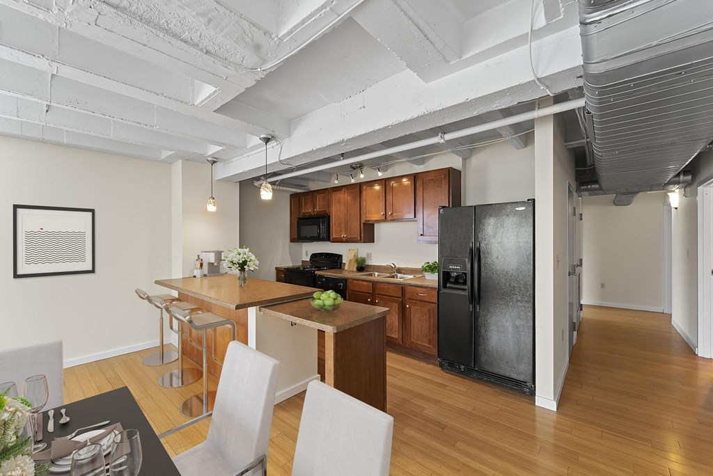 a kitchen and dining area in a 555 waverly unit