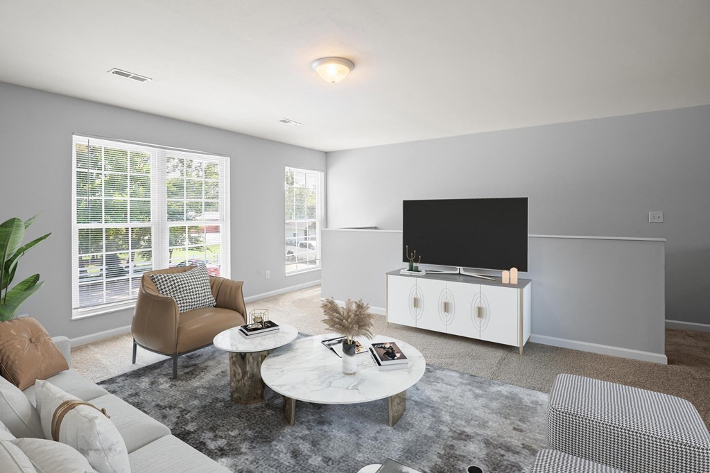 a living room with gray walls and a white coffee table