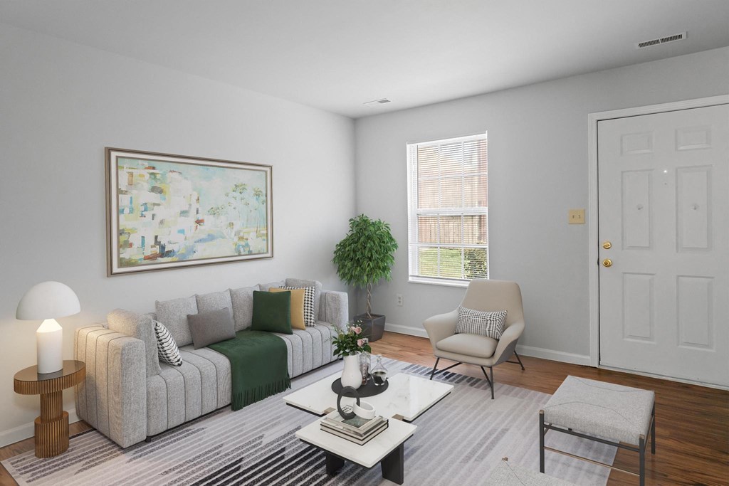 a living room with grey walls and a white door