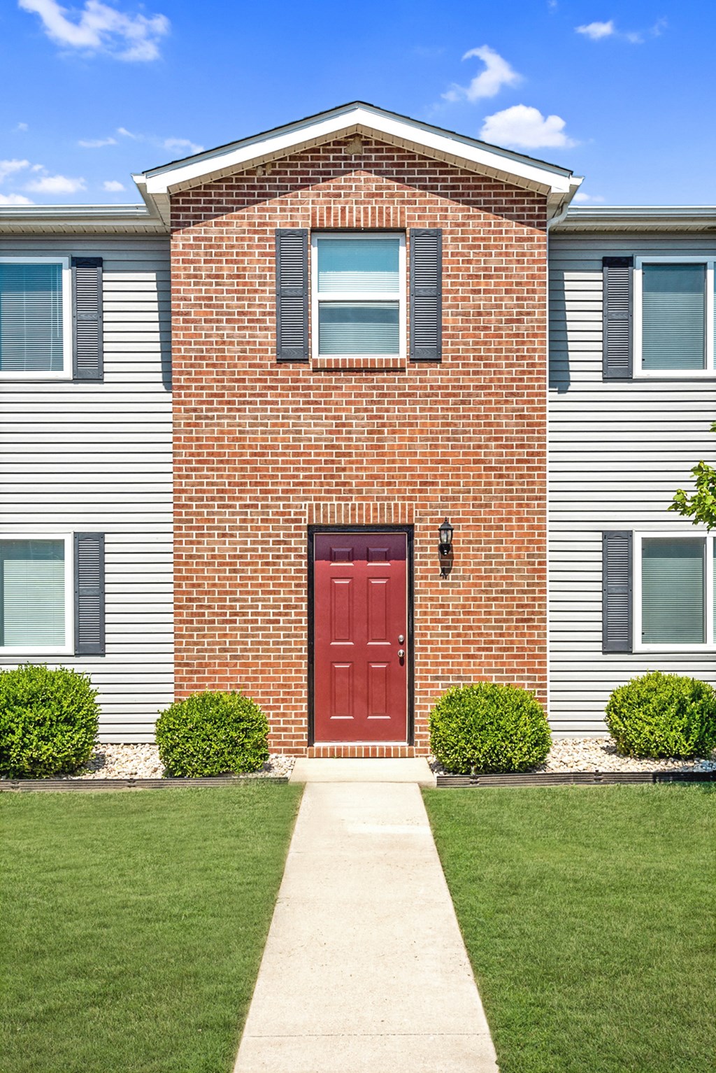 a red door on a white house