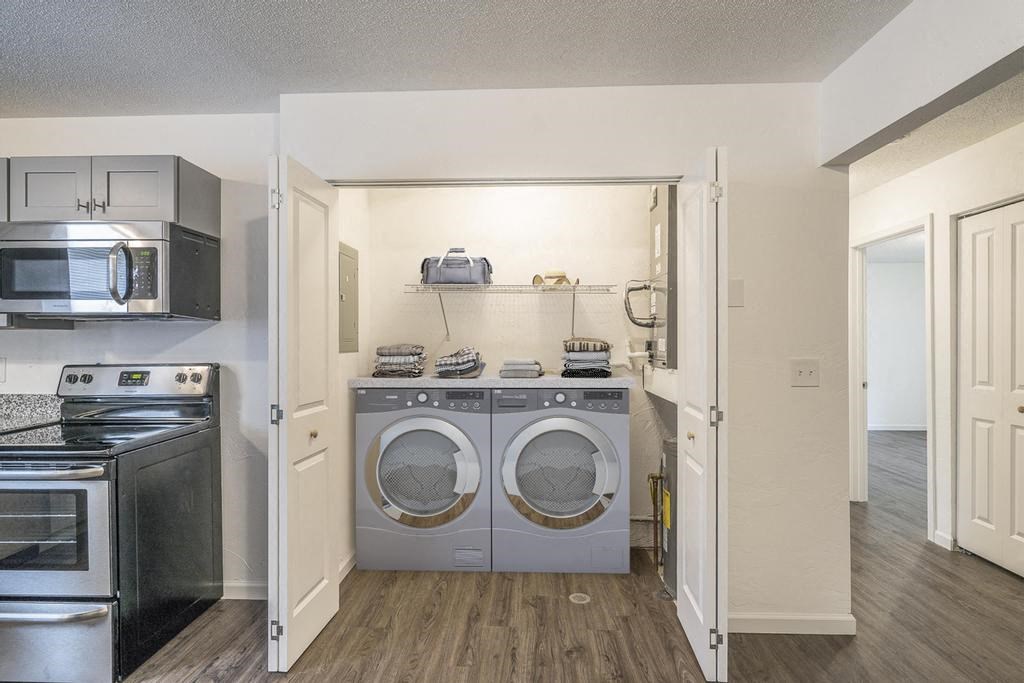 a laundry room with a washer and dryer